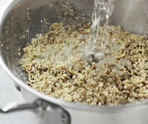 Rinse quinoa in a fine-mesh strainer until water runs clear.